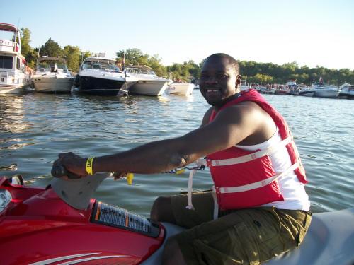 Man on a jet ski with a life jacket at Lake Lewisville