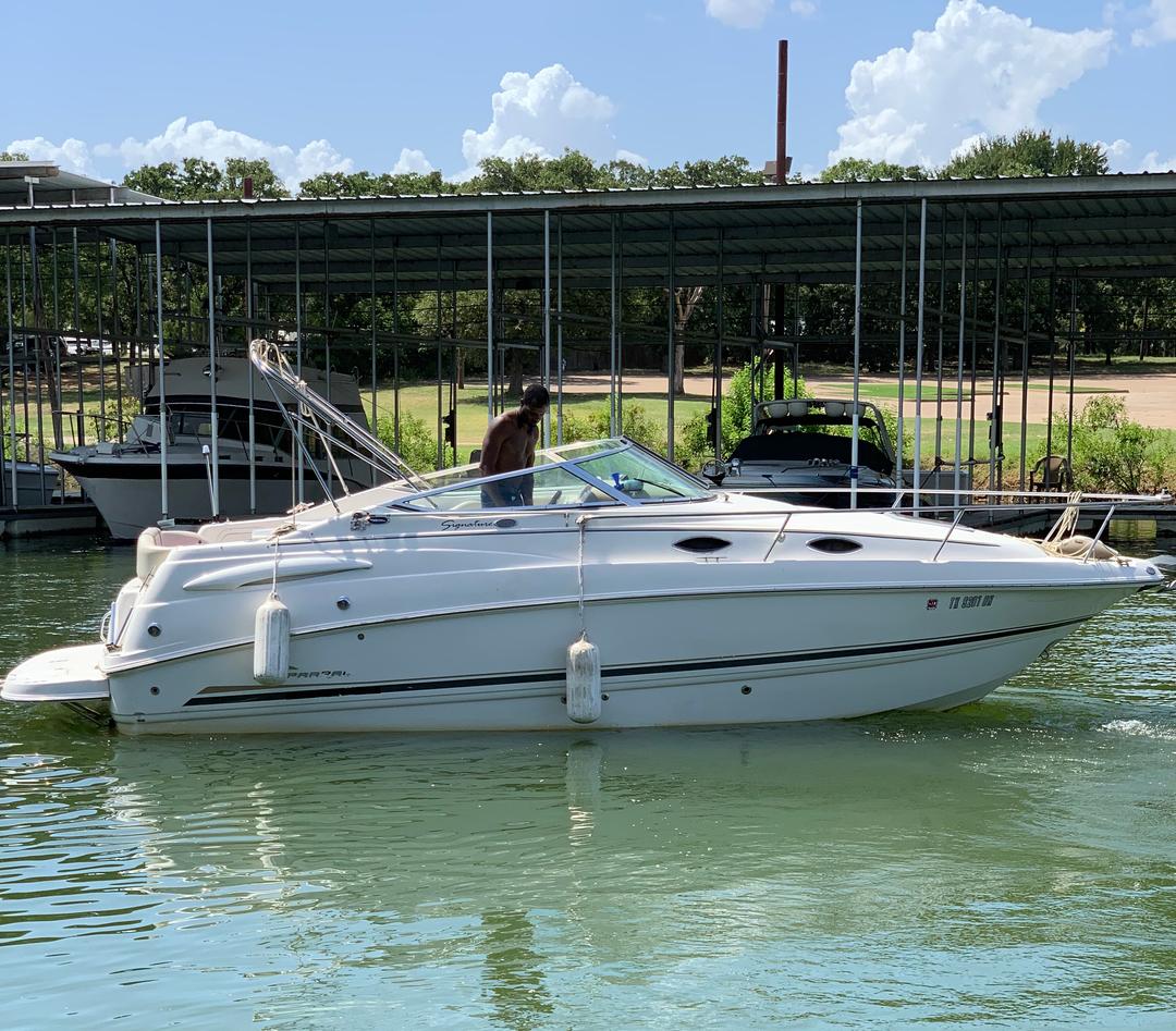 Customer enjoying a white mini yacht cruiser boat rental at Lake Lewisville