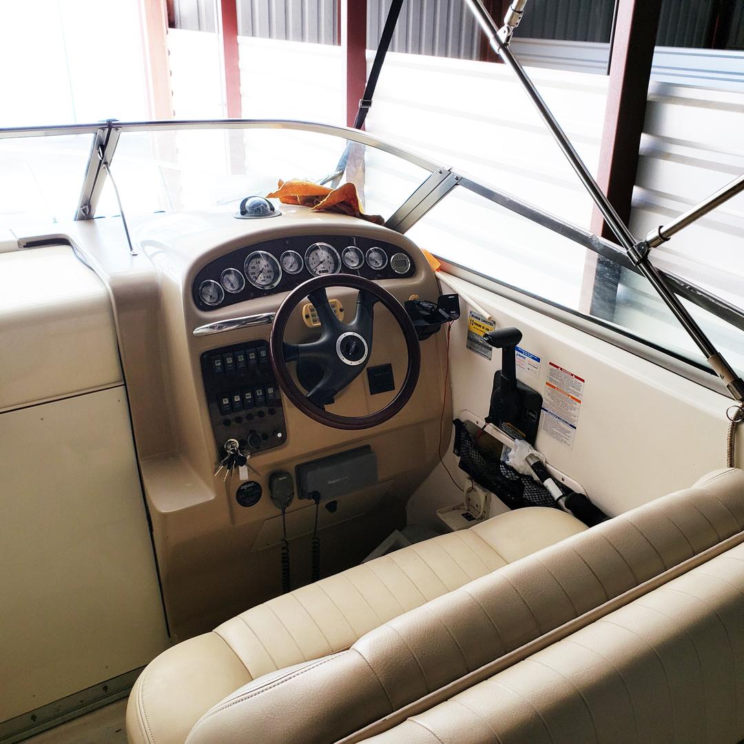 Driver's view inside a white mini yacht cruiser boat rental at Lake Lewisville